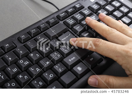 hand on the keyboard close up 45783246