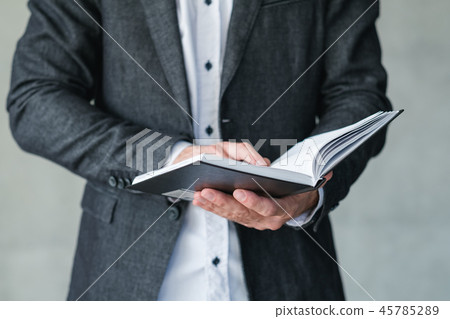 man hold notebook pen business plan strategy man hold notebook pen business plan strategy 45785289