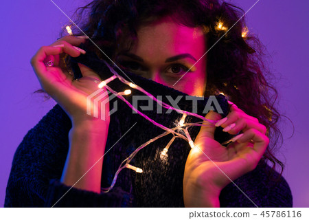 Young woman with xmas glowing lights Celebration, Christmas, New Year, Birthday 45786116
