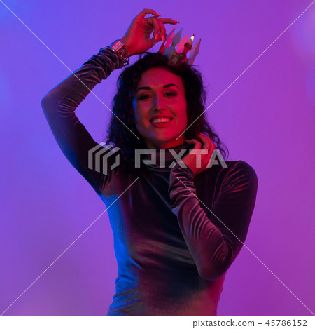 Young woman in pink blue neon lights. Creative colorful portrait Young woman in pink blue neon lights. Creative colorful portrait 45786152
