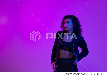 Young woman in pink blue neon lights. Creative colorful portrait Young woman in pink blue neon lights. Creative colorful portrait 45786168