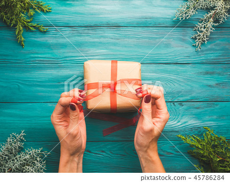 Dark green christmas background with gift box Dark green christmas background with gift box 45786284