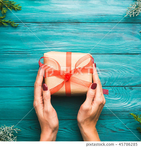 Dark green christmas background with gift box Dark green christmas background with gift box 45786285