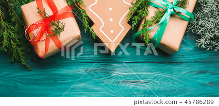 Christmas gift boxes on green background Christmas gift boxes on green background 45786289