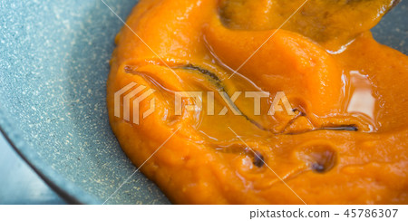 Cooking squash sauce with oil in a pan 45786307