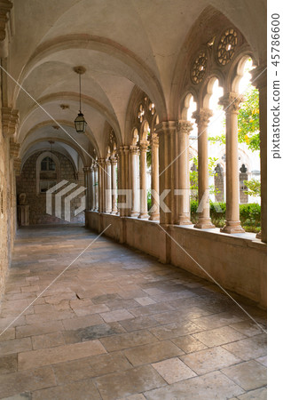 Cloister with beautiful arches and columns in old Dominican monastery in Dubrovnik Cloister with beautiful arches and columns in old Dominican monastery in Dubrovnik 45786600