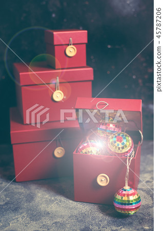 Red Christmas gift box with gold magic lights Red Christmas gift box with gold magic lights 45787206