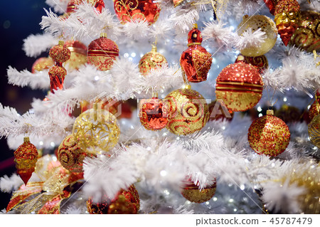 Branch of white artificial Christmas tree  45787479