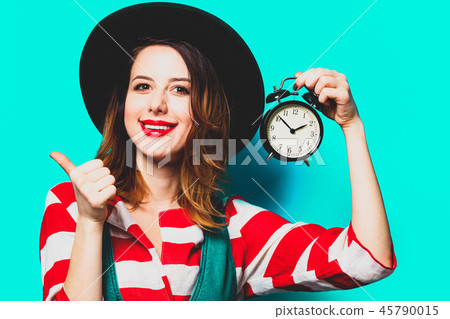 Woman with alarm clock 45790015