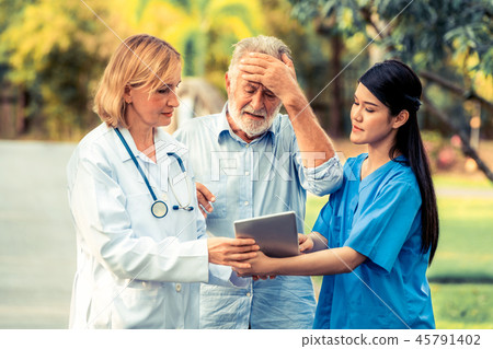 Senior couple talking to nurse or caregiver. 45791402