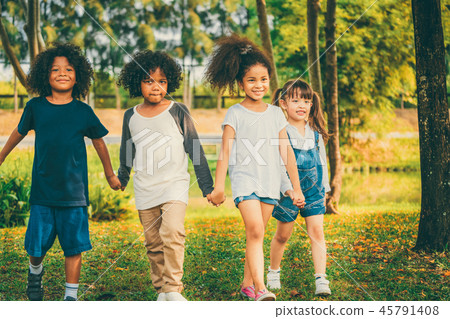 Happy kids group playing in the park in school. 45791408