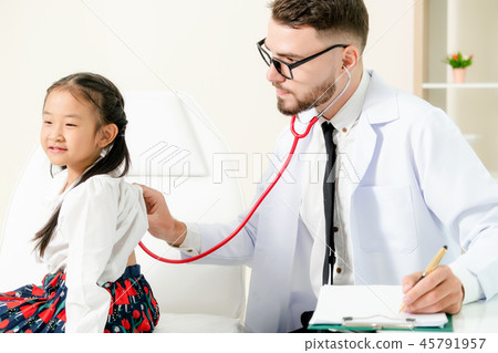 Doctor examining little happy kid in hospital. Doctor examining little happy kid in hospital. 45791957