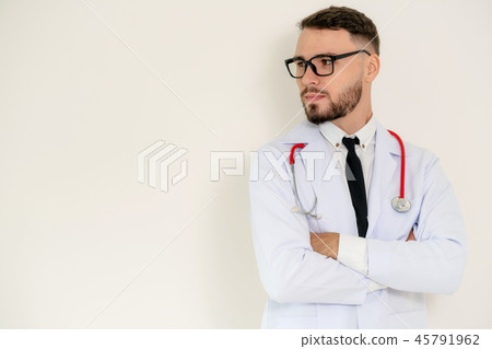 Young doctor with arms cross on white background. Young doctor with arms cross on white background. 45791962