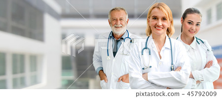 Doctor working in hospital with other doctors. 45792009