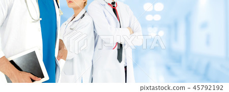 Doctor working in hospital with other doctors. 45792192