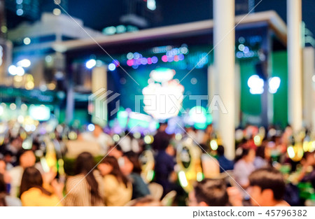 Blurred view on night scene of people  45796382