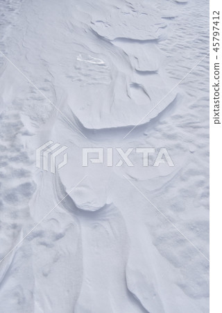 Winter's back sunlight pattern of snow surface 45797412