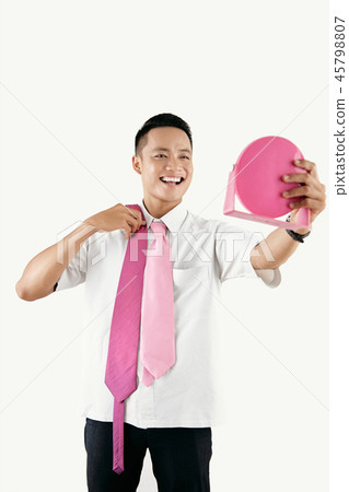 Cheerful Office Worker Picking Tie Cheerful Office Worker Picking Tie 45798807