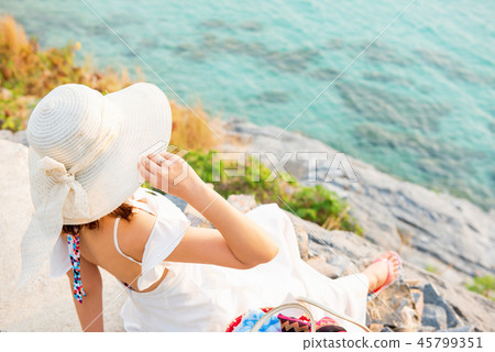 Beautiful women travel alone at the beach Summer 45799351