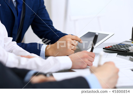 Bookkeepers team or financial inspectors  making report, calculating and checking balance. Ta 45800854