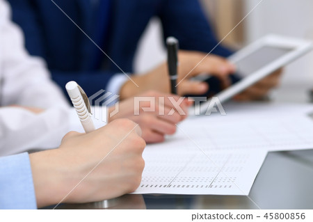 Bookkeepers team or financial inspectors making report, calculating and checking balance. Ta Bookkeepers team or financial inspectors making report, calculating and checking balance. Ta 45800856
