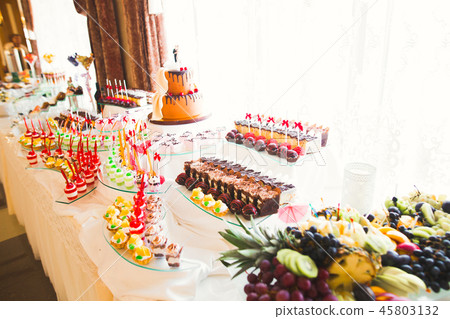 Different kinds of baked sweets on a buffet Different kinds of baked sweets on a buffet 45803132