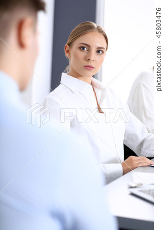 Group of business people or lawyers discussing terms of transaction in office. Colleagues workin Group of business people or lawyers discussing terms of transaction in office. Colleagues workin 45803476