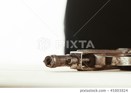 the gun is on the table 45803824