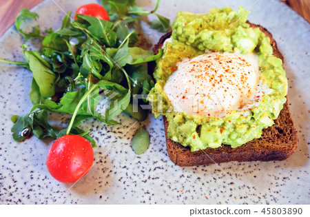 vegetable salad and a slice of bread with fried 45803890