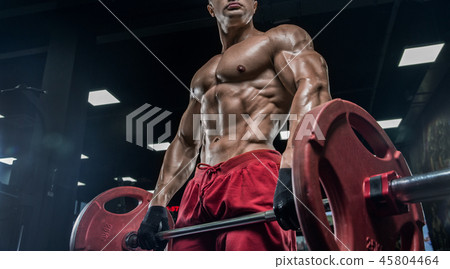 Muscular athletic bodybuilder fitness model posing Muscular athletic bodybuilder fitness model posing 45804464