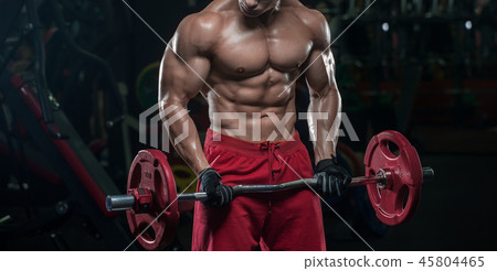 Muscular athletic bodybuilder fitness model posing 45804465