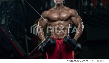 Muscular athletic bodybuilder fitness model posing Muscular athletic bodybuilder fitness model posing 45804466