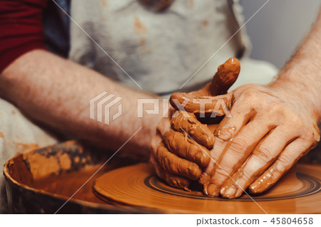 Potter makes a jug Potter makes a jug 45804658