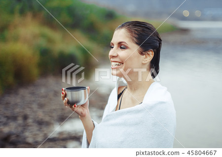 girl drinking tea after bath 45804667