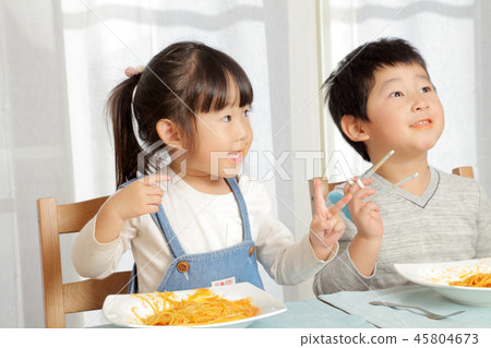 Brother eating pasta Brother eating pasta 45804673