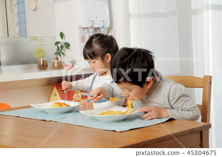 Brother eating pasta 45804675