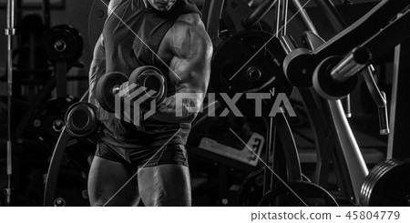 Handsome man with big muscles, posing at the camer 45804779