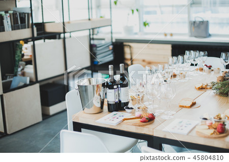 Table setting with wine and snacks, etiquette and event Table setting with wine and snacks, etiquette and event 45804810