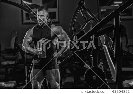 Handsome man with big muscles, posing at the camer 45804831