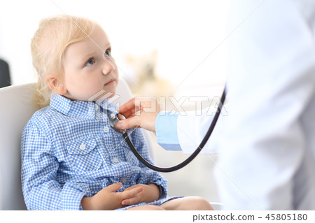 Doctor examining a little blonde girl with stethoscope.Medicine and healthcare concept Doctor examining a little blonde girl with stethoscope.Medicine and healthcare concept 45805180