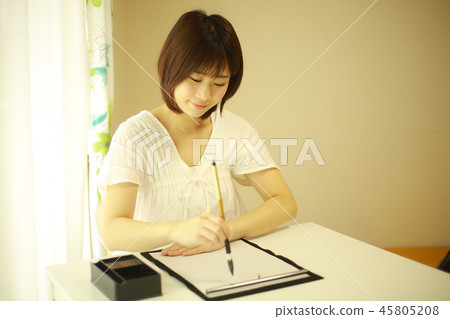 Female doing calligraphy 45805208