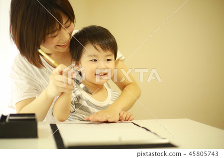 Parent and child doing calligraphy 45805743
