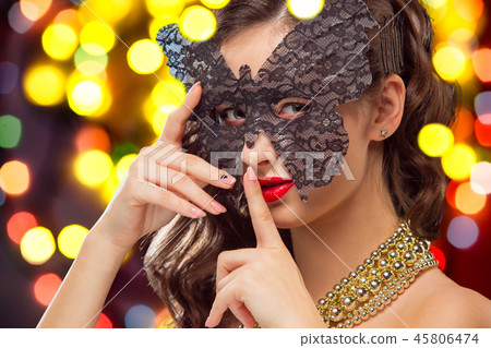 Beauty model woman wearing venetian masquerade carnival mask at party 45806474