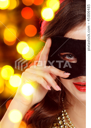Beauty model woman wearing venetian masquerade carnival mask at party 45806485