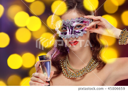 Beauty model woman wearing venetian masquerade carnival mask at party Beauty model woman wearing venetian masquerade carnival mask at party 45806659
