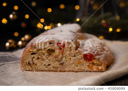 Traditional European Christmas pastry, fragrant home baked stollen, with spices and dried fruit. Traditional European Christmas pastry, fragrant home baked stollen, with spices and dried fruit. 45809099