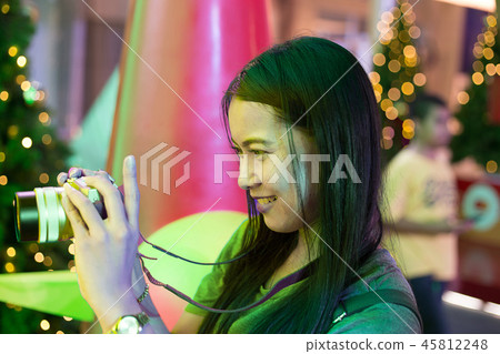 Young Asia woman in celebration Christmas Holiday Young Asia woman in celebration Christmas Holiday 45812248