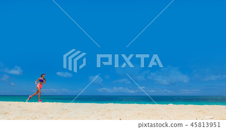 Woman running on summer beach 45813951