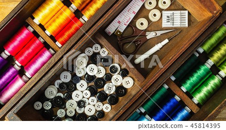 Sewing tools and accessories with colorful threads 45814395