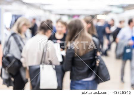 Blured image of businesspeople networking and socializing during coffee break at business event. Blured image of businesspeople networking and socializing during coffee break at business event. 45816546
